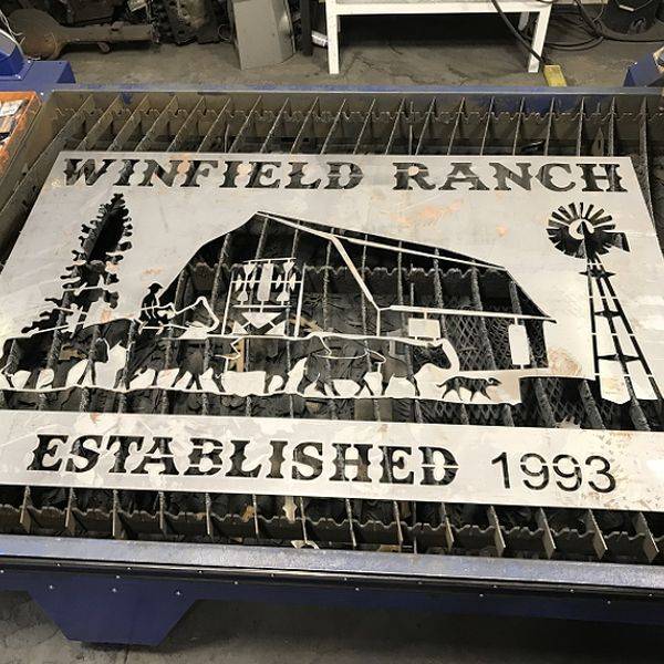 Metal sign plasma-cut with a barn, trees, windmill and Established 1993 lettering