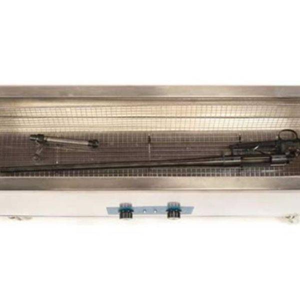 Rifle resting in a stainless steel ultrasonic cleaning tray.