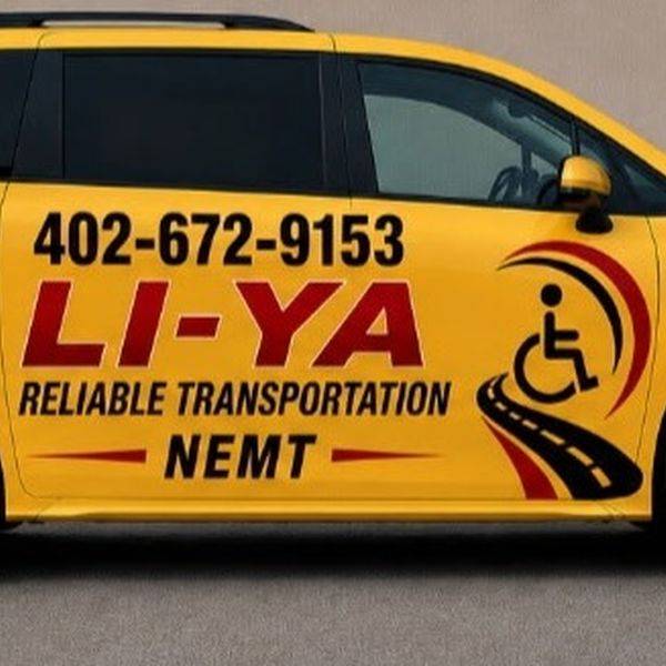 Side view of a yellow LI-YA minivan with the phone number and NEMT lettering.
