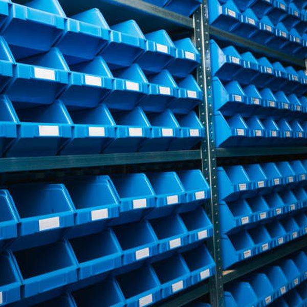 Rows of blue storage bins holding parts on tall steel shelving.