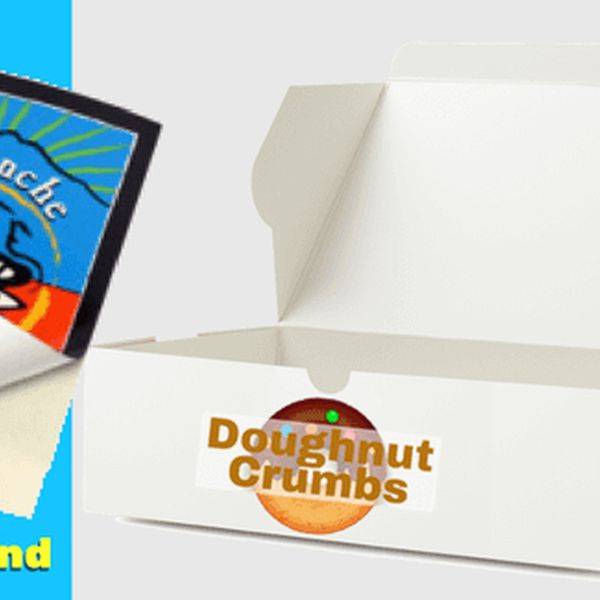 White printed food box with a doughnut logo, showing custom packaging.